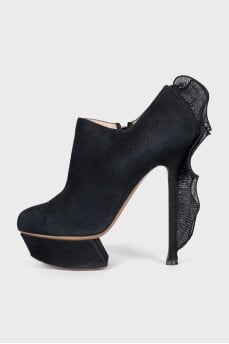 Ankle boots with voluminous decor