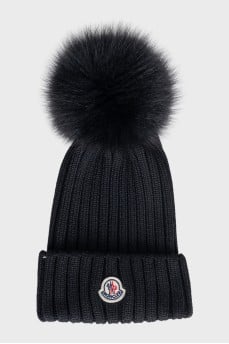 Black hat with a pompom