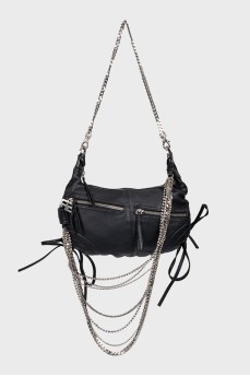 Leather bag decorated with chains and crystals