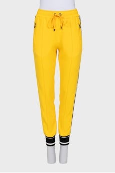 Sports yellow trousers with stripes