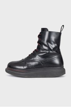 Black boots with perforations