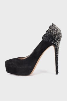 Black suede shoes decorated with rhinestones