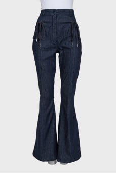 Flared jeans decorated with lacing