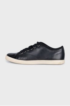 Black sneakers with patent toes