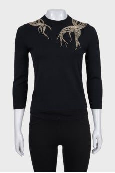 Fitted jumper decorated with beads
