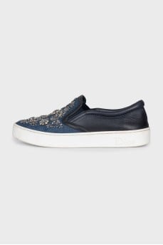 Textile slip-ons decorated with sequins