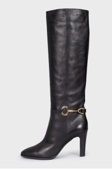 Black leather boots with gold trim