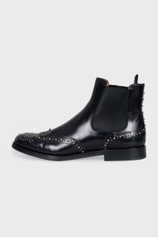 Black leather boots with metallic decor