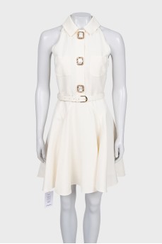 White sleeveless dress with chunky buttons