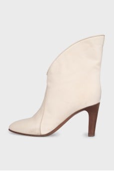 Ankle boots with a shaped top