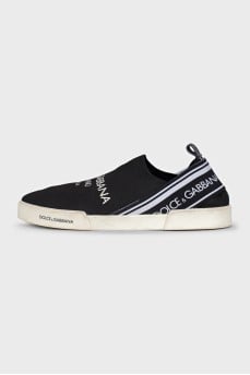 Textile slip-ons with a signature print