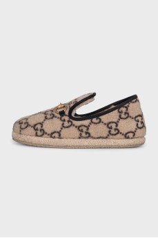 Insulated slip-ons with a signature monogram