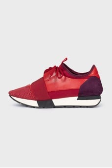 Red sneakers made of textile and leather