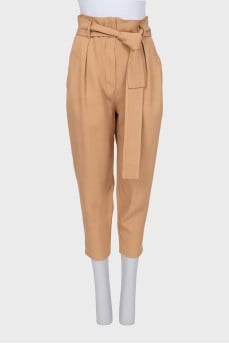 Beige tapered trousers with a belt