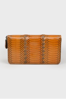 Wallet with an embossed snake pattern