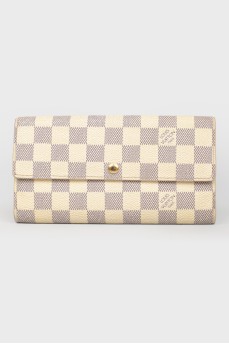 White wallet in a corporate print