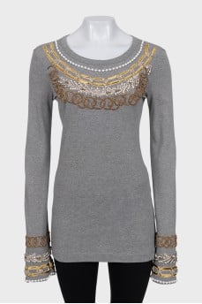 Long sleeve decorated with crystals and beads