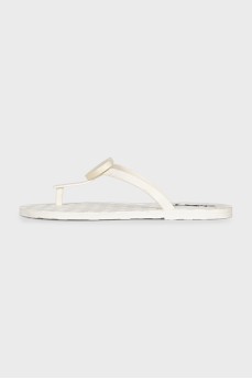 Rubber flip flops with a brand logo