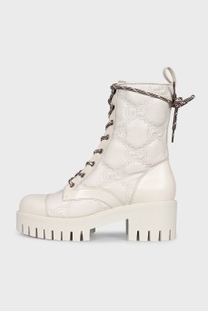 Beige boots with branded embossing