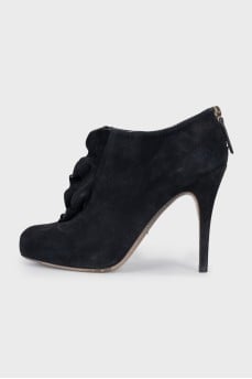 Black suede ankle boots with ruffles
