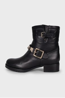 Black leather boots with signature decor