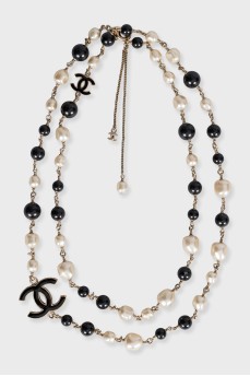 Black and white beaded necklace with logo