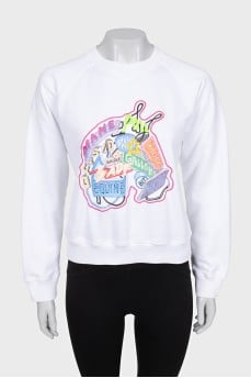 White sweatshirt with bright embroidery