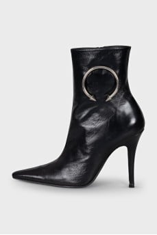Black leather ankle boots with metallic embellishments