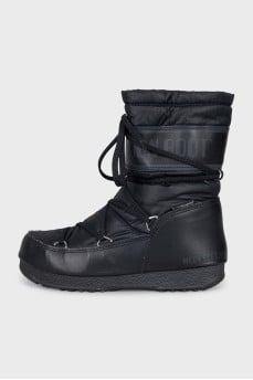 Black puffer boots with leather inserts