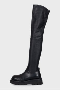 Black leather over-the-knee boots with a round toe