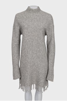 Oversized dress decorated with fringe