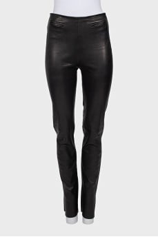 Black leather trousers with slits at the bottom
