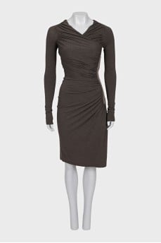 A fitted dress decorated with drapery