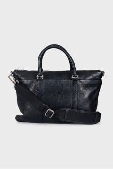 Leather bag with a textile strap