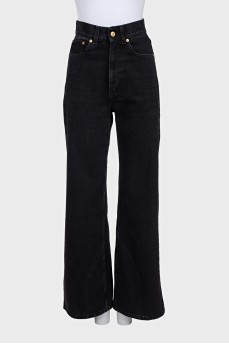 Wide-leg black jeans with gold hardware