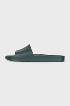 Green flip-flops with a metallic logo