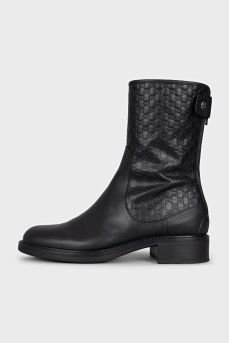 Black boots with branded embossing