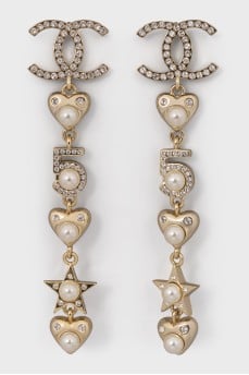 Gold-tone earrings with signature dangles