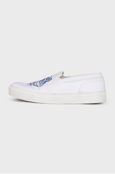 White slip-ons with branded embroidery