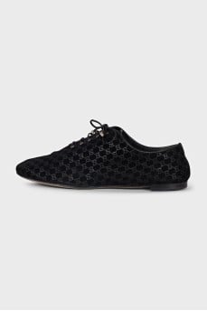 Black suede shoes with branded embossing