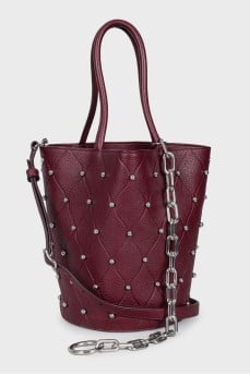 Leather bucket bag with metal embellishments