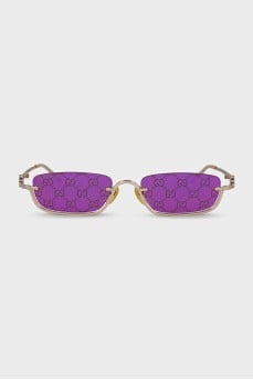 Gold sunglasses with logo on the lens