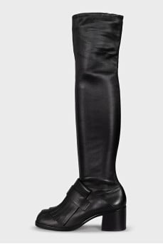 Black over-the-knee boots with leather tassels