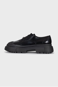 Black brogues with rubber toes