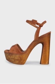 Suede sandals with a gold platform
