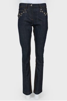 Blue jeans with metal jewelry