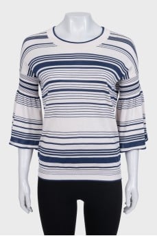 White jumper with blue stripes