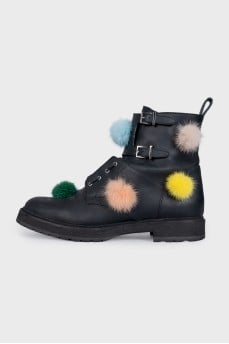 Leather boots decorated with pom-poms
