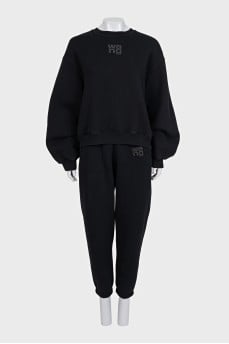 A suit consisting of a sweatshirt and tapered trousers