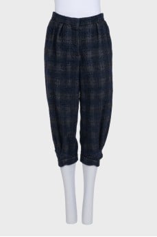 Blue tapered capri pants in a plaid print